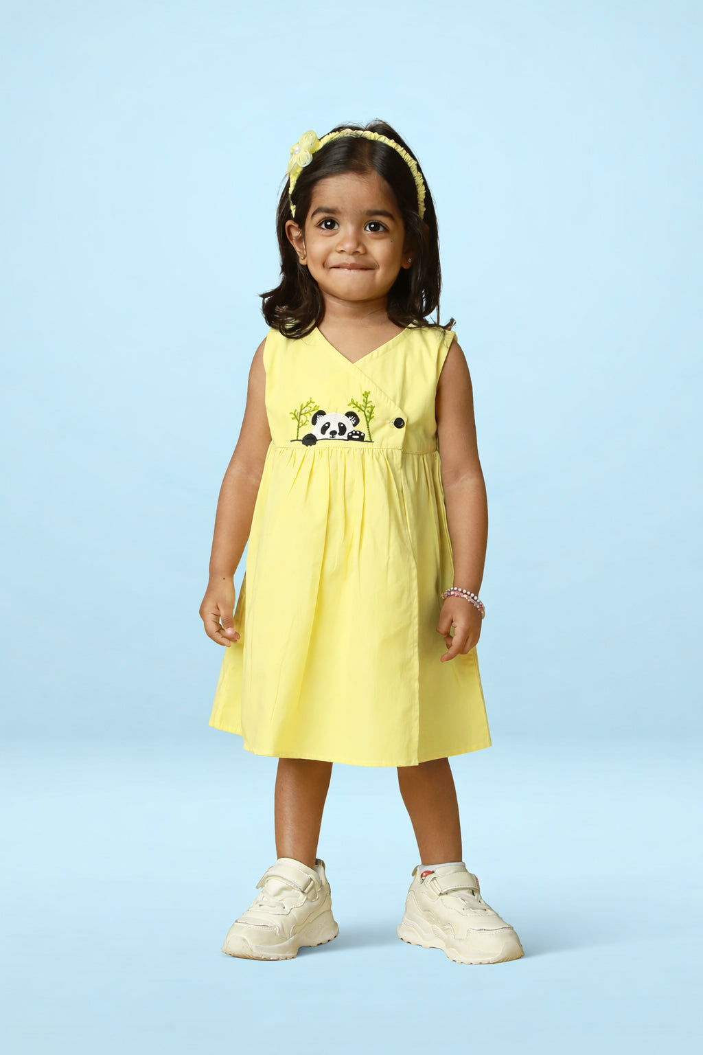 Yellow cotton baby girl dress with cute panda embroidery, sleeveless wrap neckline and flared skirt by Mini Tantini