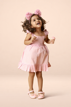 Premium pink cotton baby dress with bunny embroidery and soft flared silhouette